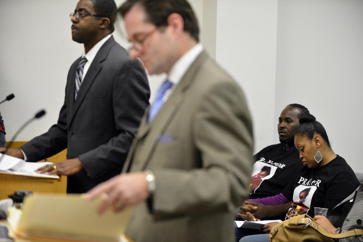 Brian Franklin, left, attorney for Children's Hospital Oakland, and Christopher Dolan, attorney for Nailah Winkfield, mother of Jahi McMath, speaks during a court hearing to discuss the treatment of Winkfield's daughter in Oakland. Among those in the courtroom were Martin Winkfield and wife Nailah Winkfield, behind the attorneys.