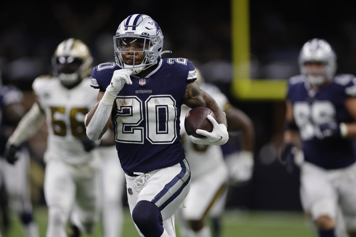 Dallas Cowboys running back Tony Pollard carries the ball against the New Orleans Saints on Dec. 2.