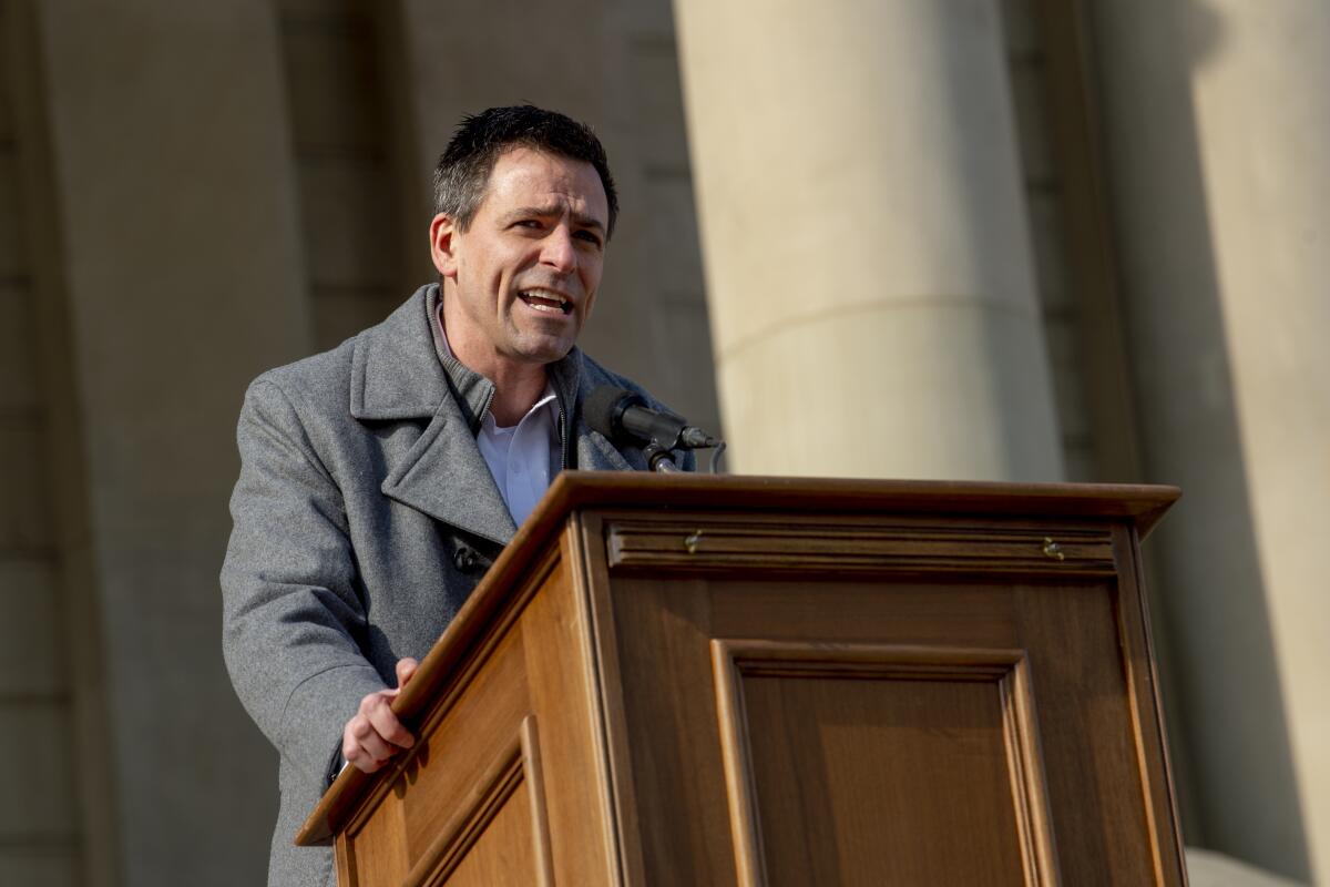 Ryan Kelley speaks at a lectern.