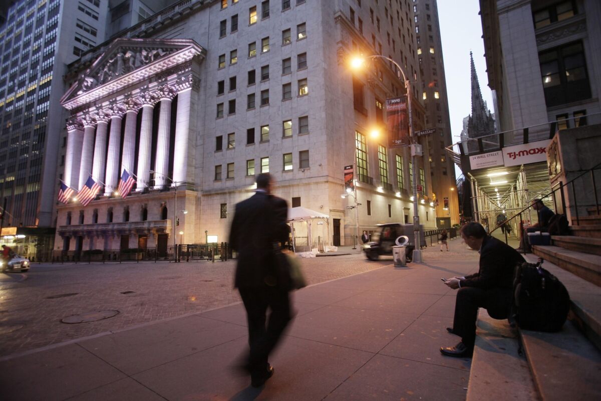 A man walks to work near the New York Stock Exchange.