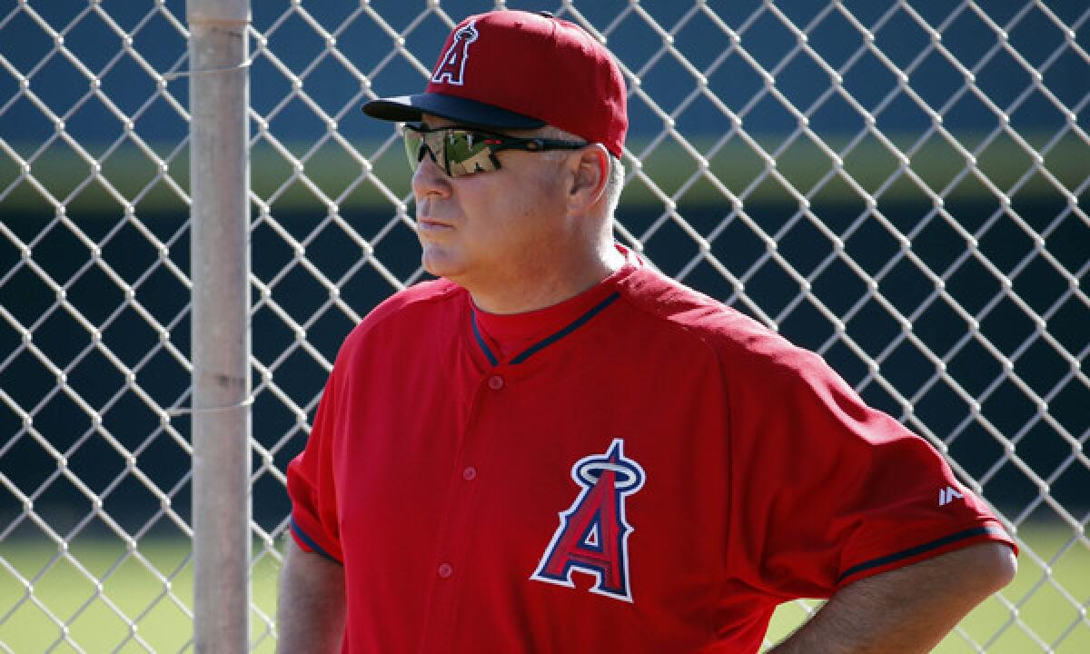 Angels Manager Mike Scioscia watches his team during a spring-training practice session in Tempe, Ariz., on Feb. 15. Scioscia was unsuccessful in his attempt to have a call reversed via instant replay during Monday's exhibition game against the Arizona Dimaondbacks.