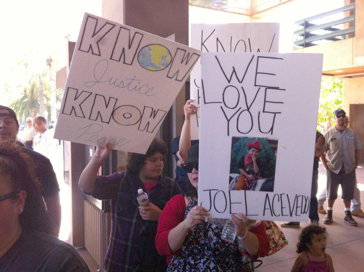 Donna Acevedo-Nelson protests her son's killing in front of City Hall on July 24, 2012.