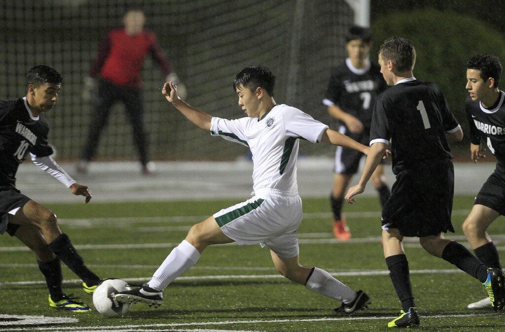 Sage Hill School's Danny Lee, center, competes against Brethren Christian during the second half in an Academy League game on Thursday.