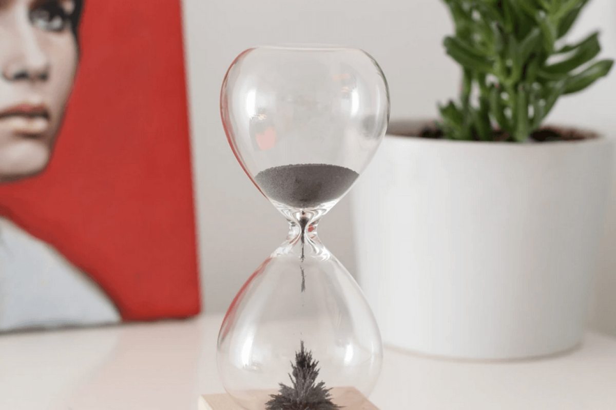 An hourglass filled with magnetic sand.