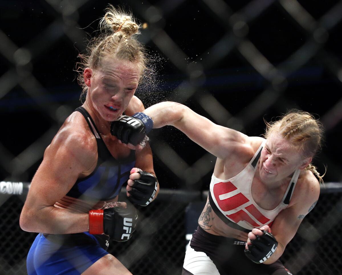 Valentina Shevchenko lands an overhand right against Holly Holm during their bantamweight fight on Saturday at UFC Chicago.