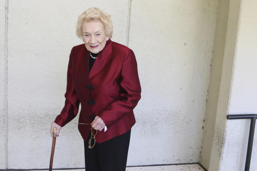 FILE - Native Hawaiian heiress Abigail Kawānanakoa poses outside a Honolulu courthouse on Oct. 25, 2019. There will be at least $100 million leftover to fund Native Hawaiian causes from the estate of the so-called last Hawaiian princess who died last year at age 96. According to court documents filed last week in the probate case for the estate of Abigail Kawānanakoa, $40 million will go to her wife. (AP Photo/Jennifer Sinco Kelleher, File)