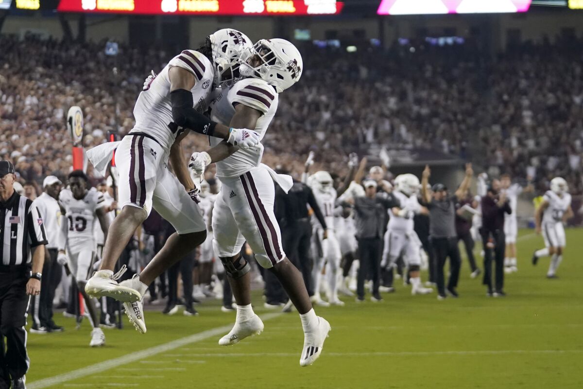 Mississippi State wide receiver Makai Polk (10) and running back Jo'quavious Marks (7) react after Polk scored a touchdown against Texas A&M during the first half of an NCAA college football game, Saturday, Oct. 2, 2021, in College Station, Texas. (AP Photo/Sam Craft)