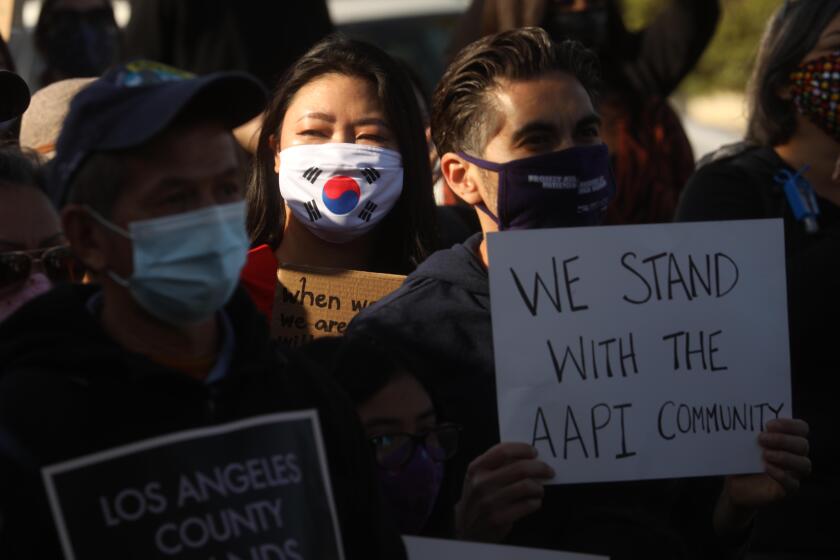 ALHAMBRA, CA - MARCH 26, 2021 - - Around 200 residents, students and Alhambra and San Gabriel city leaders participate in a rally to denounce anti-Asian sentiment, racism and hate crimes that have been exacerbated by the COVID-19 pandemic in Alhambra on March 26, 2021. The march started at San Gabriel City Hall and proceeded to Alhambra City Hall. (Genaro Molina / Los Angeles Times)
