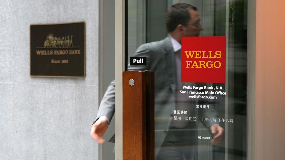 A Wells Fargo customer enters a bank branch in San Francisco.