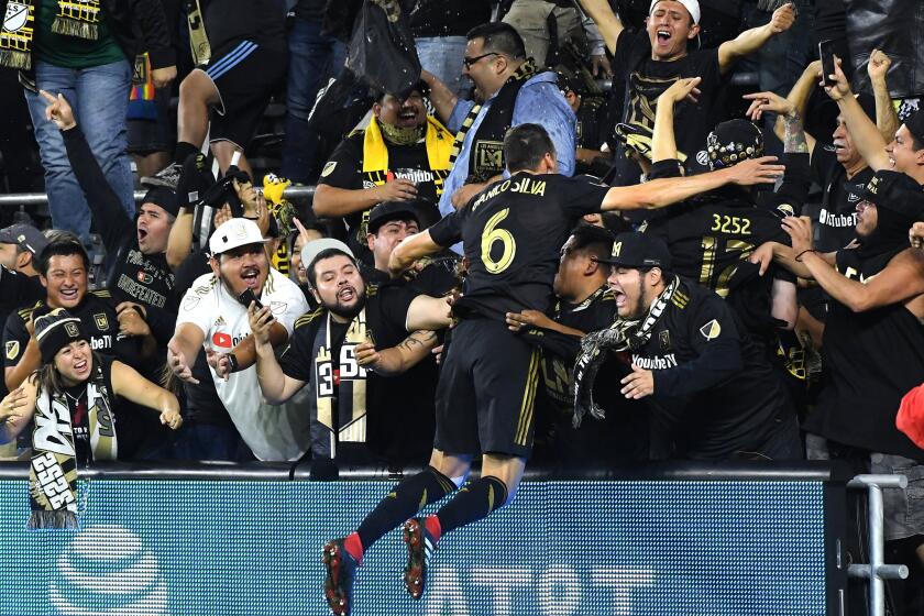 Wally Skalij  Los Angeles Times DANILO SILVA celebrates at Banc of California Stadium with LAFC’s fans.