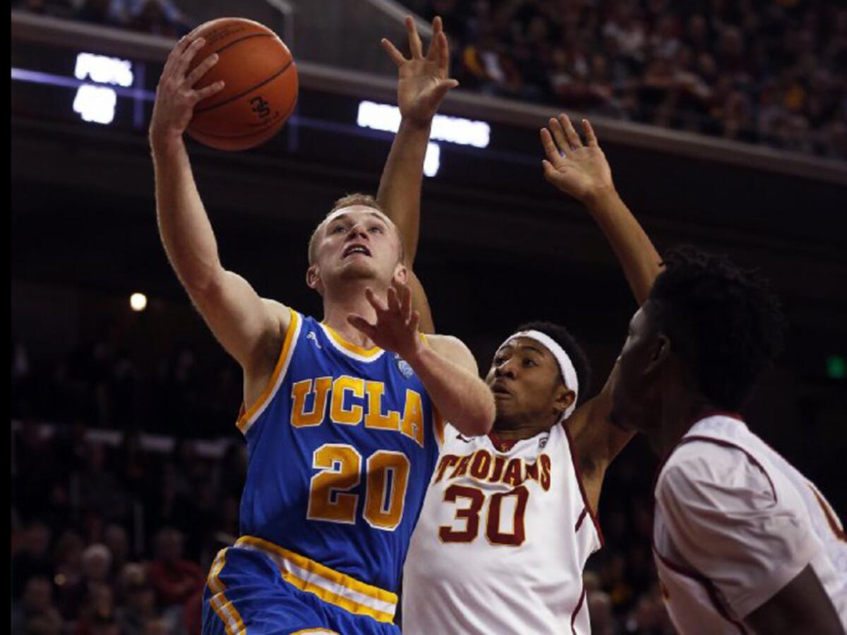 UCLA guard Bryce Alford drives to the basket against USC guard Elijah Stewart during a game on Feb. 4.