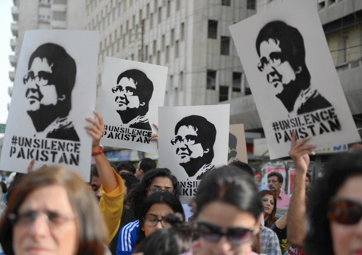 Activists gather in Karachi, Pakistan, in April to protest the slaying of rights advocate Sabeen Mahmud. She was slain after she left a Karachi meeting about missing people in Baluchistan.