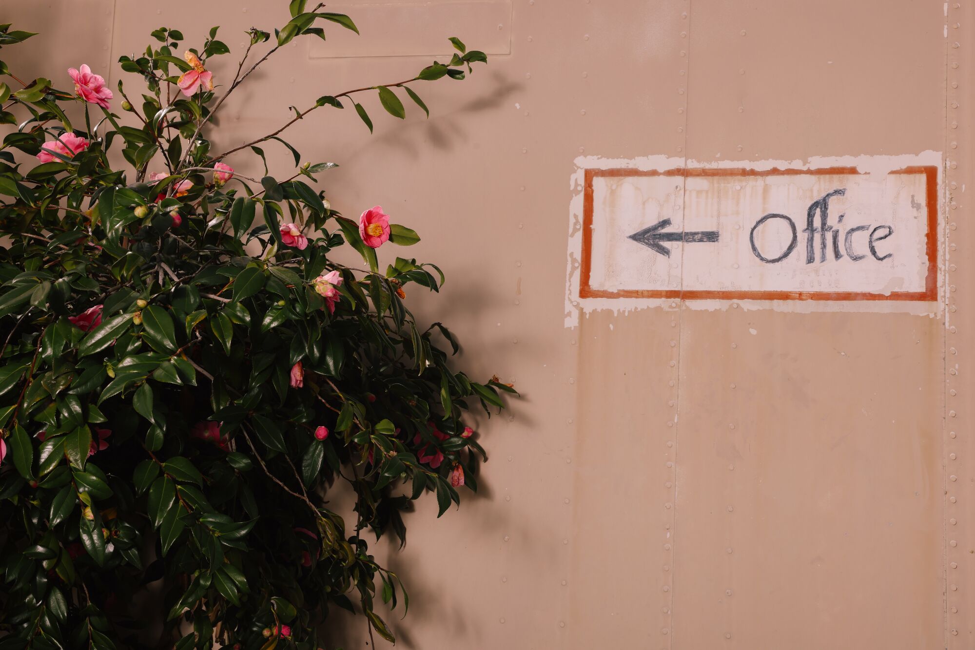 A sign points customers to the main office.