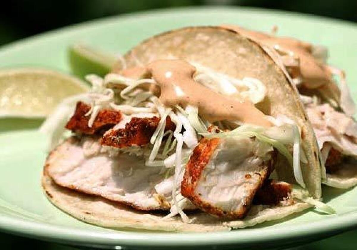 Achiote-marinated yellowtail with cabbage and chipotle mayonnaise.