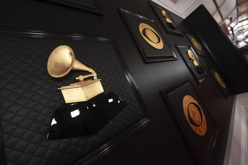 FILE - A view of the red carpet appears prior to the start of the 62nd annual Grammy Awards on Jan. 26, 2020, in Los Angeles. The Recording Academy told The Associated Press on Tuesday, Jan 5. 2021, that the 63rd annual Grammy Awards will no longer take place on its original Jan. 31, 2021, date in Los Angeles and will broadcast in March due to a recent surge in coronavirus cases and deaths. (Photo by Jordan Strauss/Invision/AP, File)