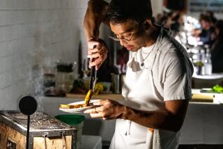 Chef /owner Justin Pichetrungsi prepares Transparent Sea Prawns in the alleyway next to his restaurant Anajak Thai