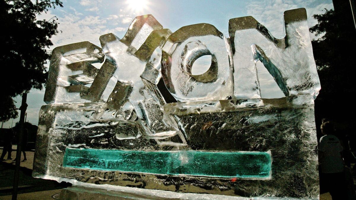 An ice sculpture fashioned by protesters, in demonstration of how the company's policies are affecting the environment, slowly melts in Dallas, Texas on May 31, 2006.