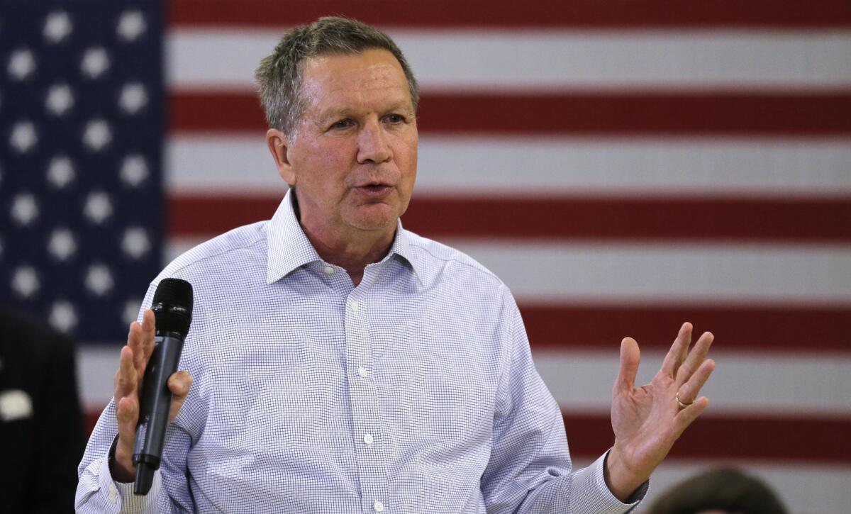 Republican presidential candidate, Ohio Gov. John Kasich answers a question during a town hall style meeting in Salem, N.H., Thursday, Dec. 3, 2015. (AP Photo/Charles Krupa)