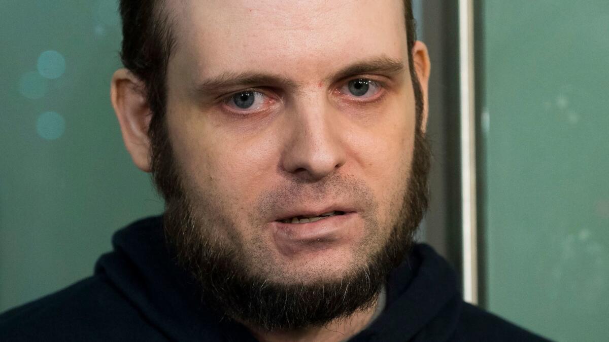 Joshua Boyle speaks to the media on Oct. 31, 2017, after arriving at Pearson International Airport in Toronto.