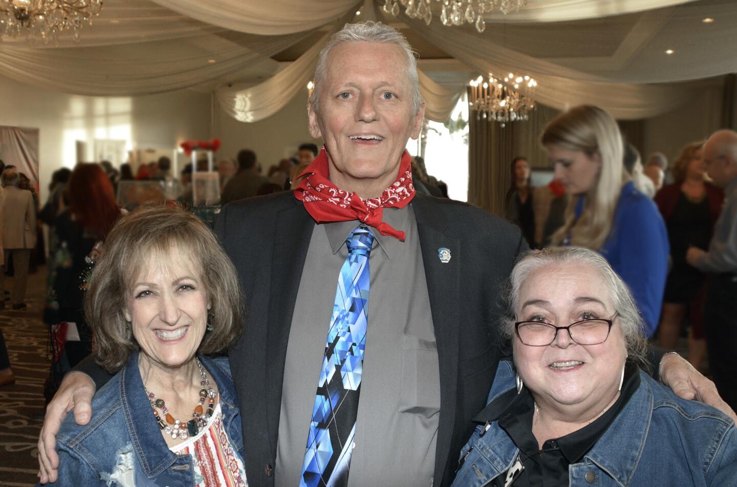 Event Chair Nancy Gams Korb, left, and BTAC Executive Director Barbara Howell welcoming Burbank Top Award for Citizenship Award honoree Mayor Will Rogers to last week's gala.