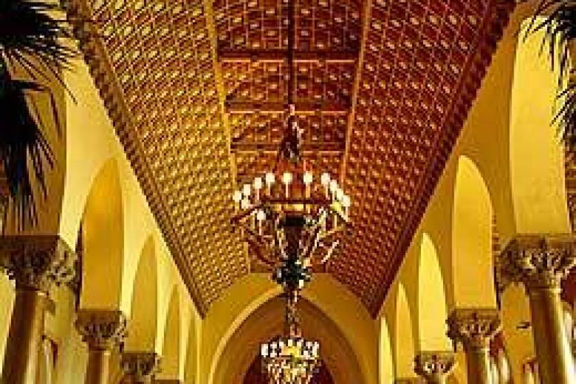 Boca Raton Resort guests enjoy a buffet in the Cathedral room. The Florida resort includes five hotels spread over 356 acres.