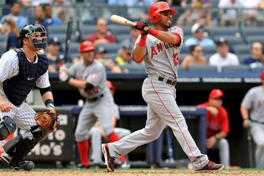 Former Los Angeles Angels infielder Maicer Izturis swings for a two-run home run against the New York Yankees on July 15, 2012.