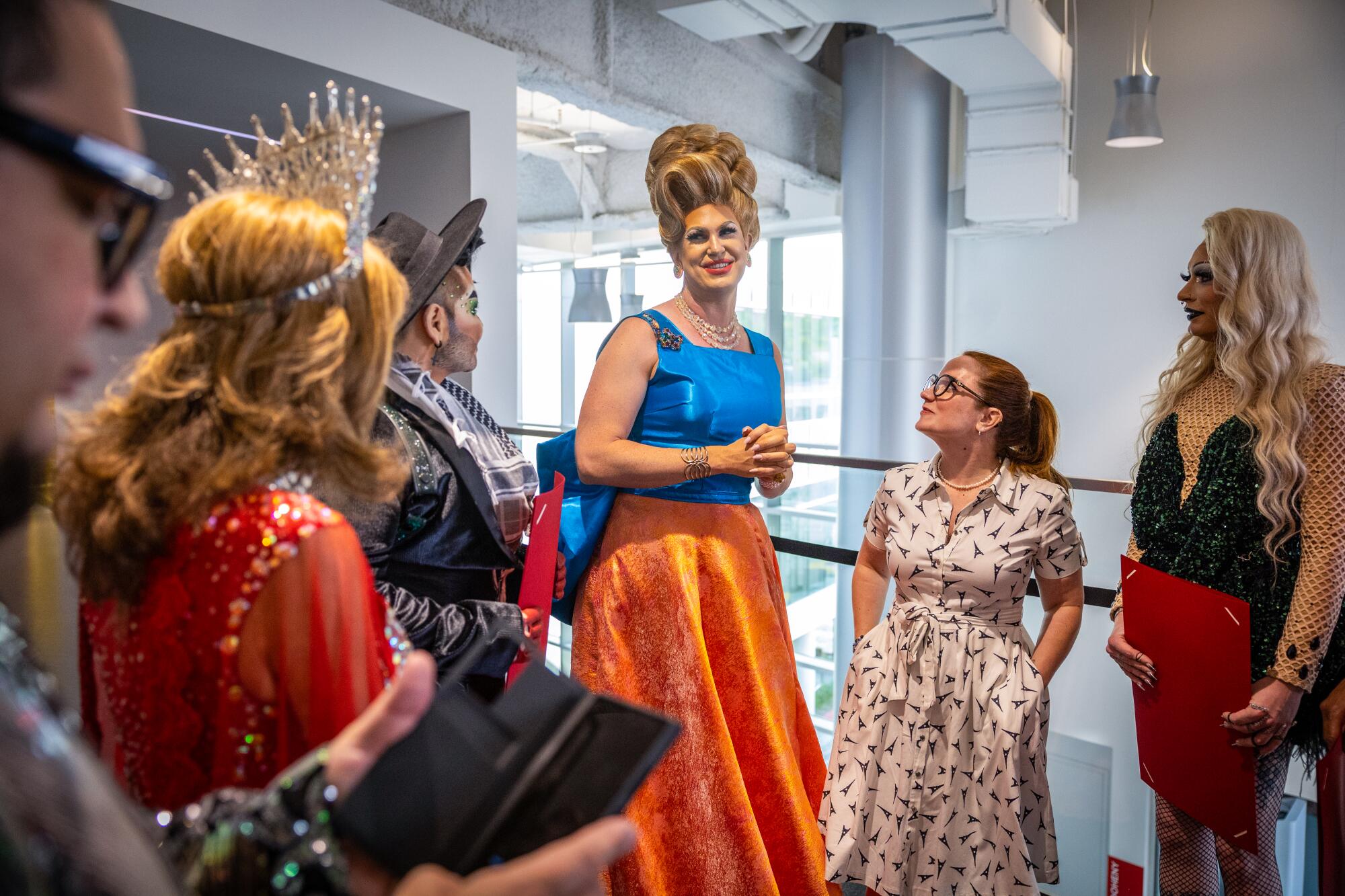 West Hollywood drag laureate Pickle, center, receives thanks from Los Angeles County Supervisor Lindsey P. Horvath.