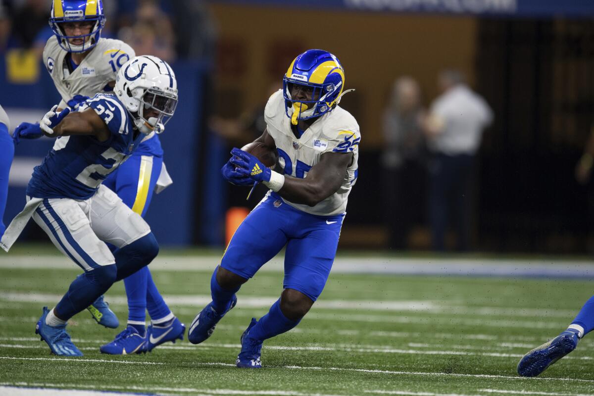  Rams running back Sony Michel (25) runs past Indianapolis Colts cornerback Kenny Moore II (23).