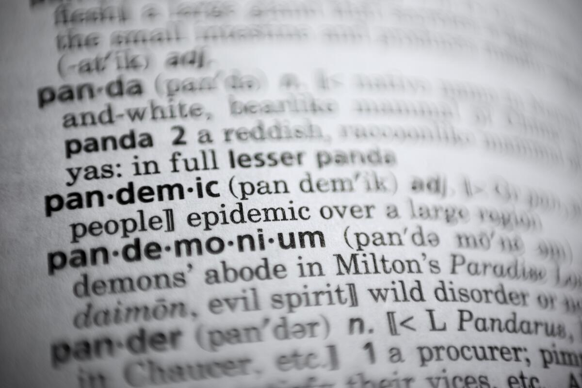The word "pandemic" is displayed in a dictionary.