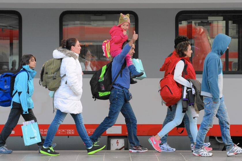 Migrants arrive in Munich, Germany.