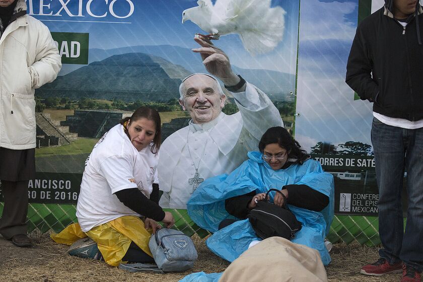 Hundreds slept outside overnight to wait for Pope Francis to arrive in Ecatepec, Mexico, on Feb. 14.