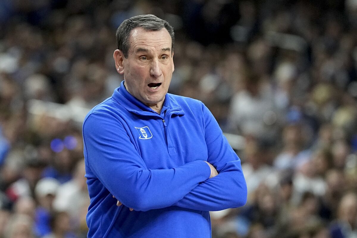Duke head coach Mike Krzyzewski watches during the first half of a college basketball game in the semifinal round of the Men's Final Four NCAA tournament, Saturday, April 2, 2022, in New Orleans. (AP Photo/David J. Phillip)