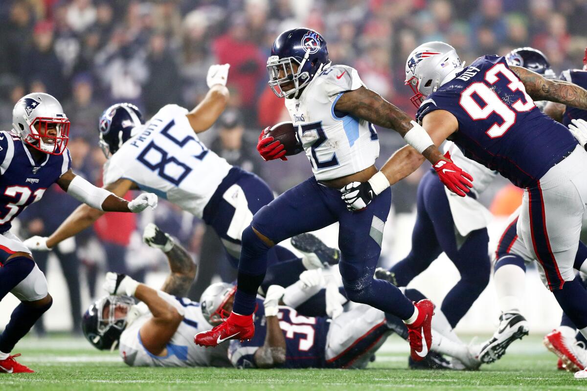 Titans running back Derrick Henry carries the ball during his team's 20-13 playoff win Jan. 4, 2020.