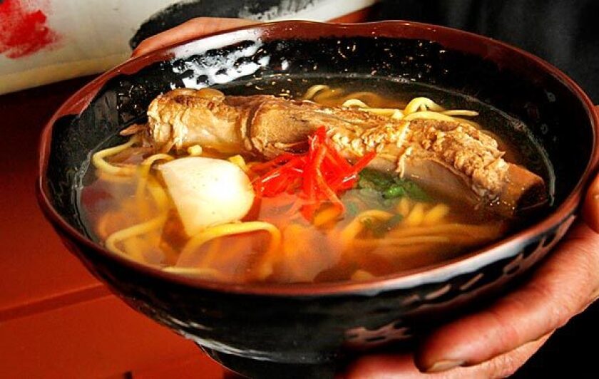Soki soba features noodles, crisp veggies and a pork rib in broth.