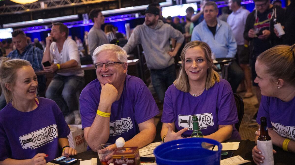 The Lankfords of Kansas City, Mo., (L-R) Paige Lankford, lan Lankford, Stephanie Lankford-Scovill, and Megan Lankford, watch NCAA March Madness basketball games at The Cosmopolitan's Hoops & Hops event on March 22, 2019 in Las Vegas.