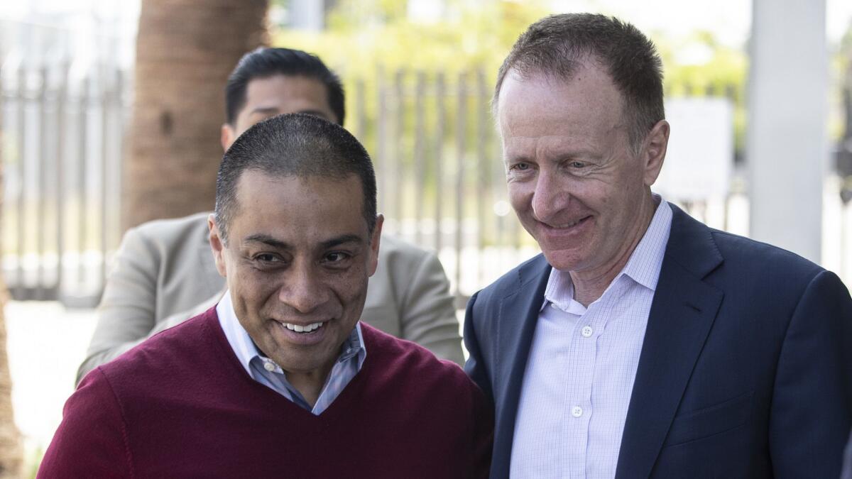 Ref Rodriguez, left, shown with L.A. schools Supt. Austin Beutner, resigned from the Board of Education in July, opening the way for a crowded field to take his place in a special election.