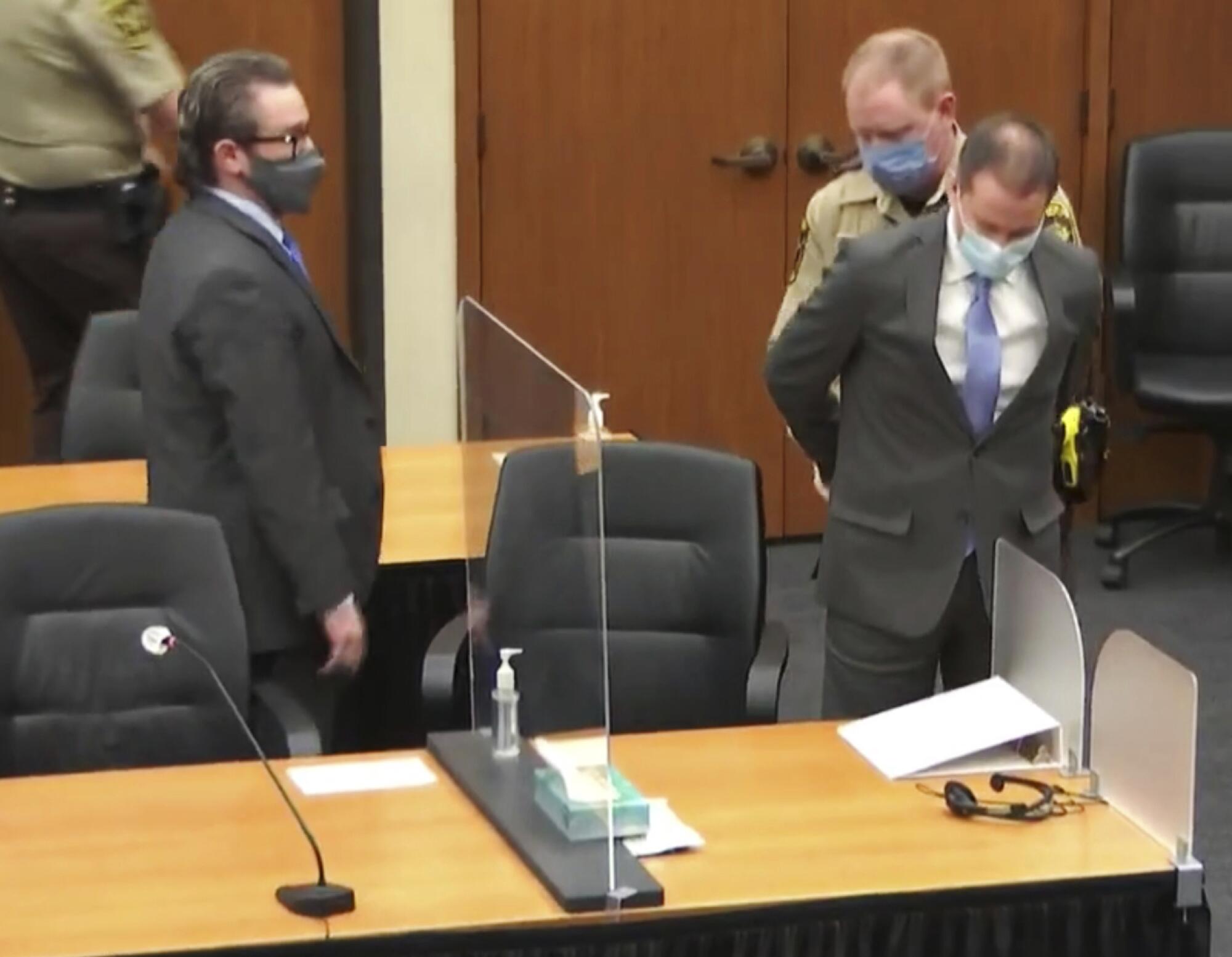 Derek Chauvin is handcuffed in court
