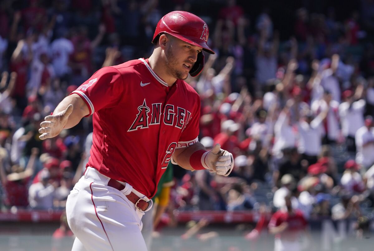Angels' Mike Trout rounds first after hitting a solo home run during the seventh inning against the Oakland Athletics.
