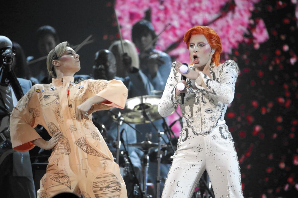 Lady Gaga, right, samples a lot of David Bowie tunes in not a lot of time. Good intentions aside, the performance felt rushed.