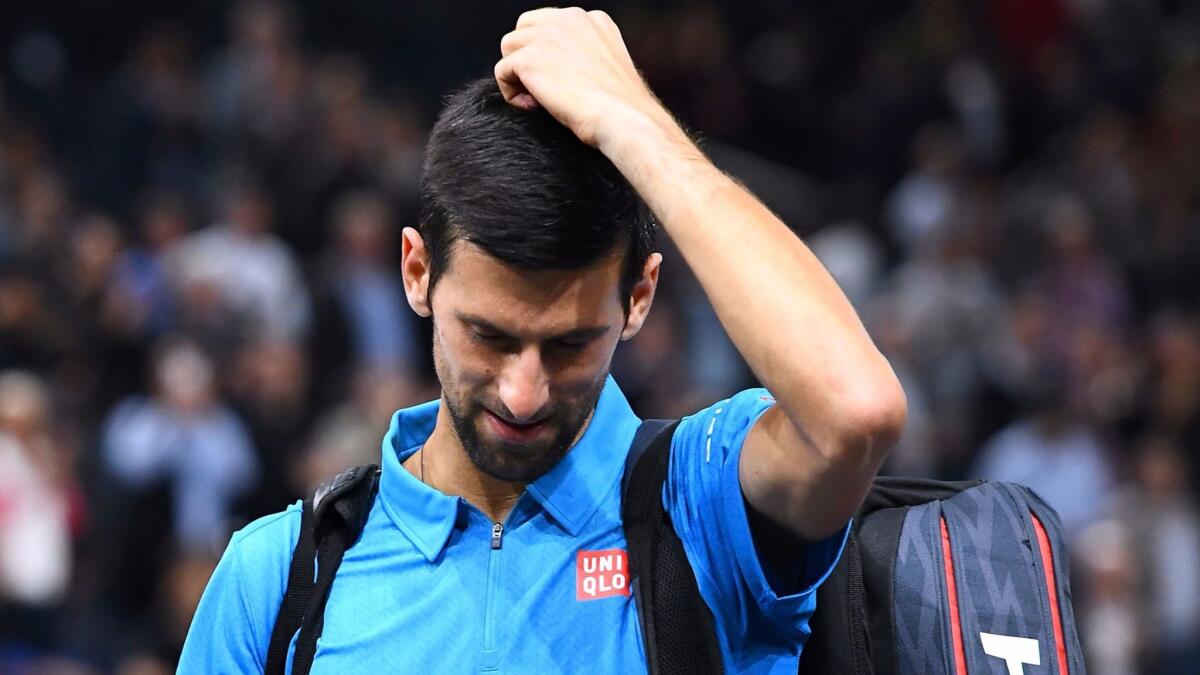 Novak Djokovic leaves the court after losing in the Paris Masters quarterfinals on Friday.