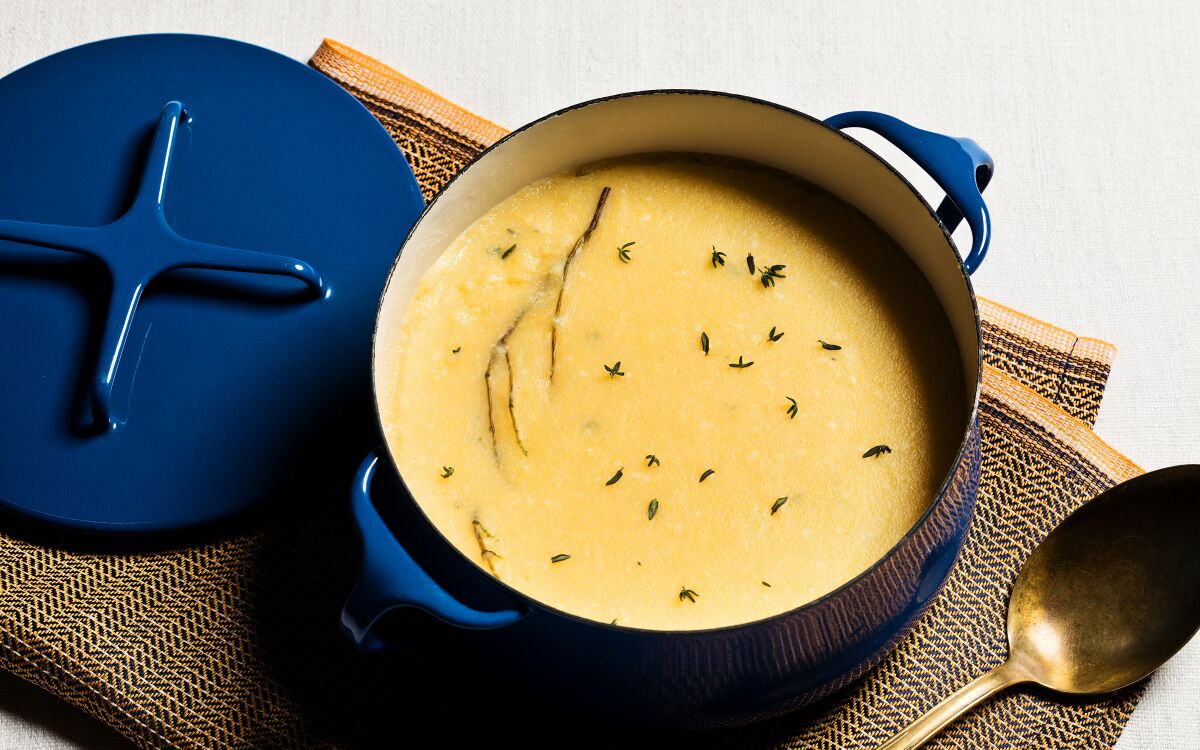 Thyme infuses the cooking broth for classic polenta, enriched with butter and Parmesan.