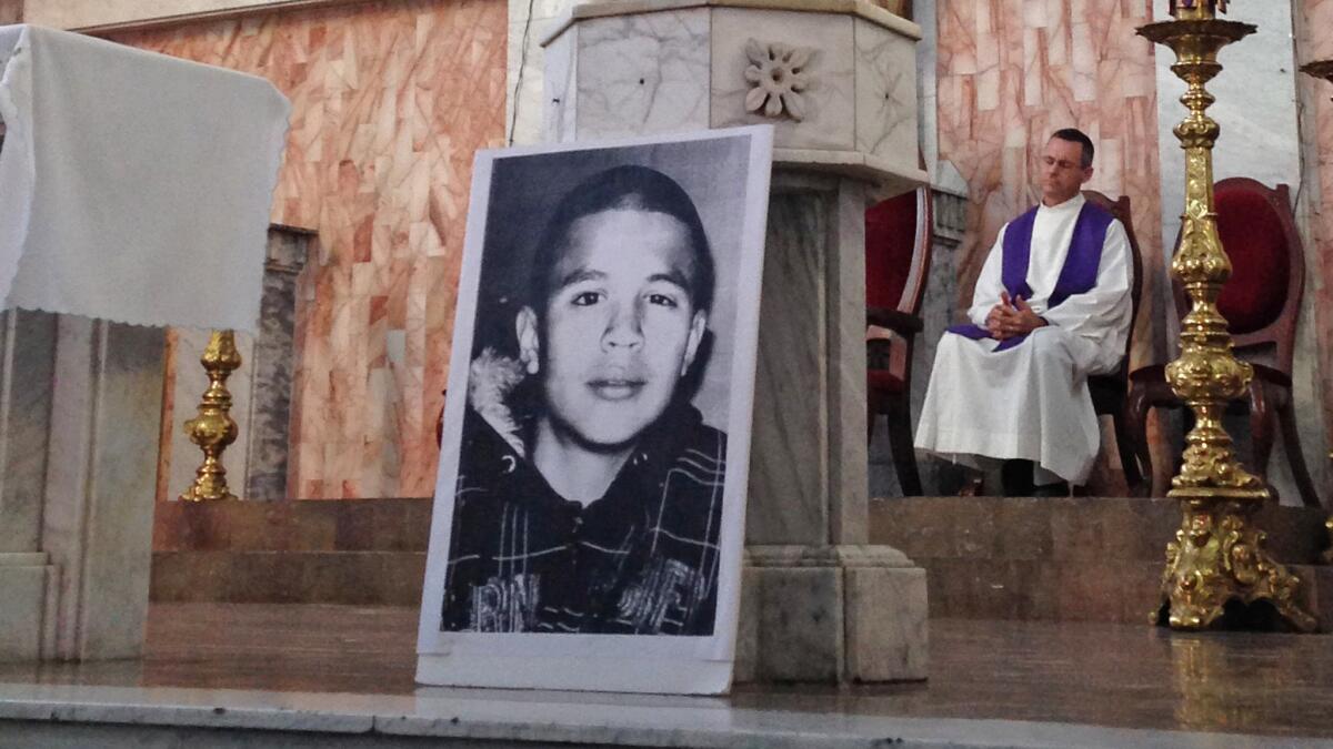 An image of Jose Antonio Elena Rodriguez is displayed at his memorial Mass. The 16-year-old was fatally shot by a U.S. Border Patrol agent in 2012.