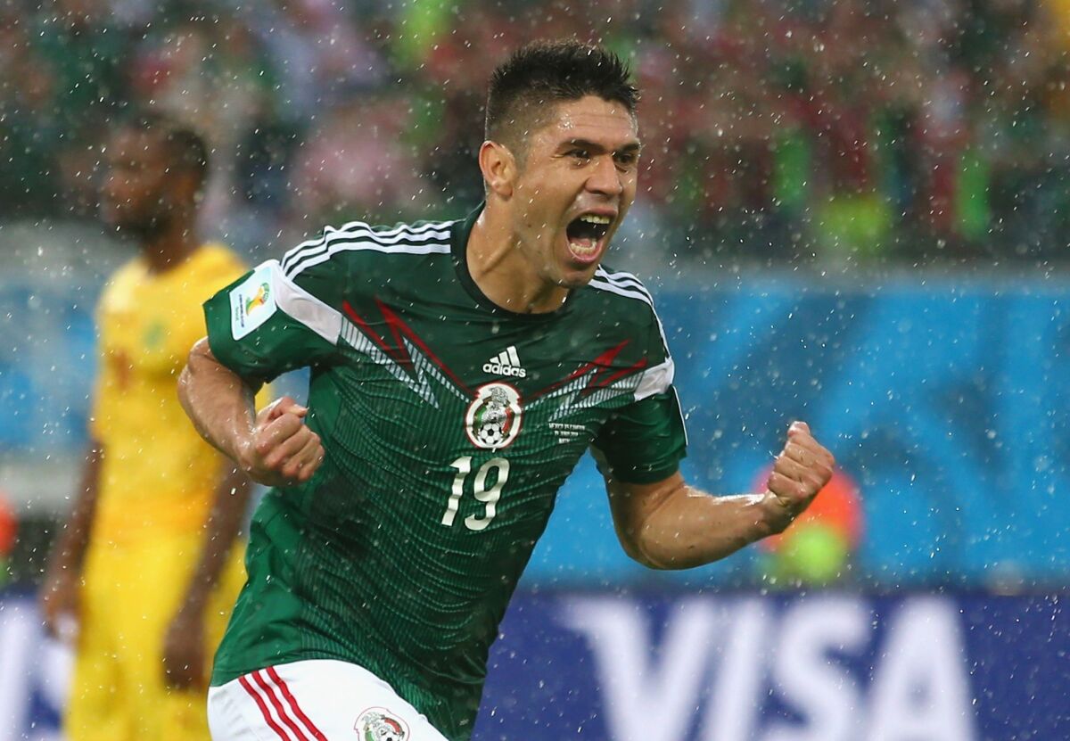 Oribe Peralta of Mexico celebrates his goal in the second half of a World Cup match Friday with Cameroon in Natal, Brazil.