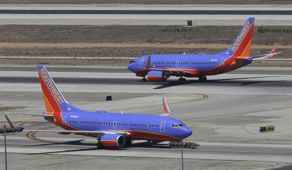 Southwest Airlines Boeing 737s at Los Angeles International Airport. The FAA is investigating what passengers on a Southwest Airlines flight described as a scary dive before the plane and made a normal landing at Raleigh-Durham International Airport.