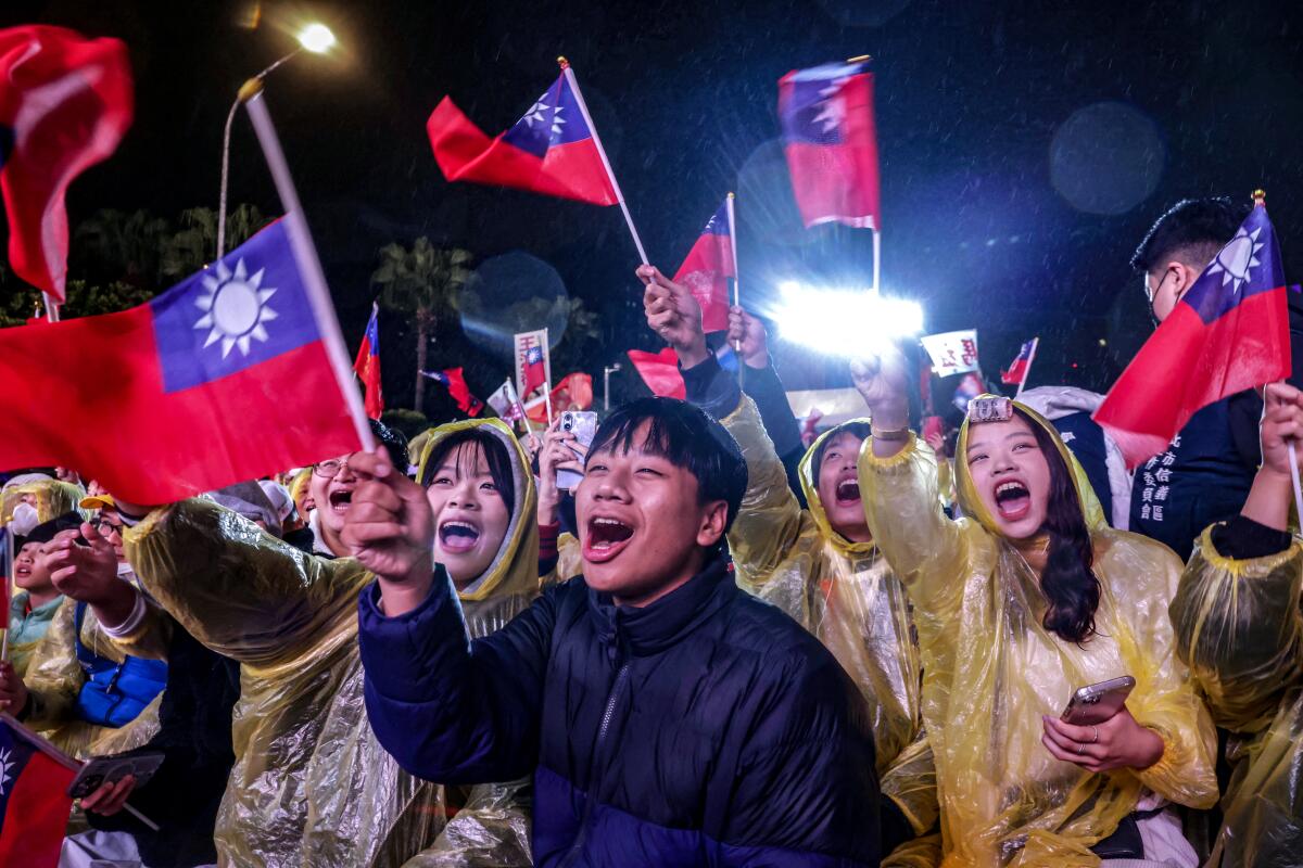 Supporters attend a Kuomintang (KMT) campaign rally ahead of Taiwan's presidential election in Taipei.