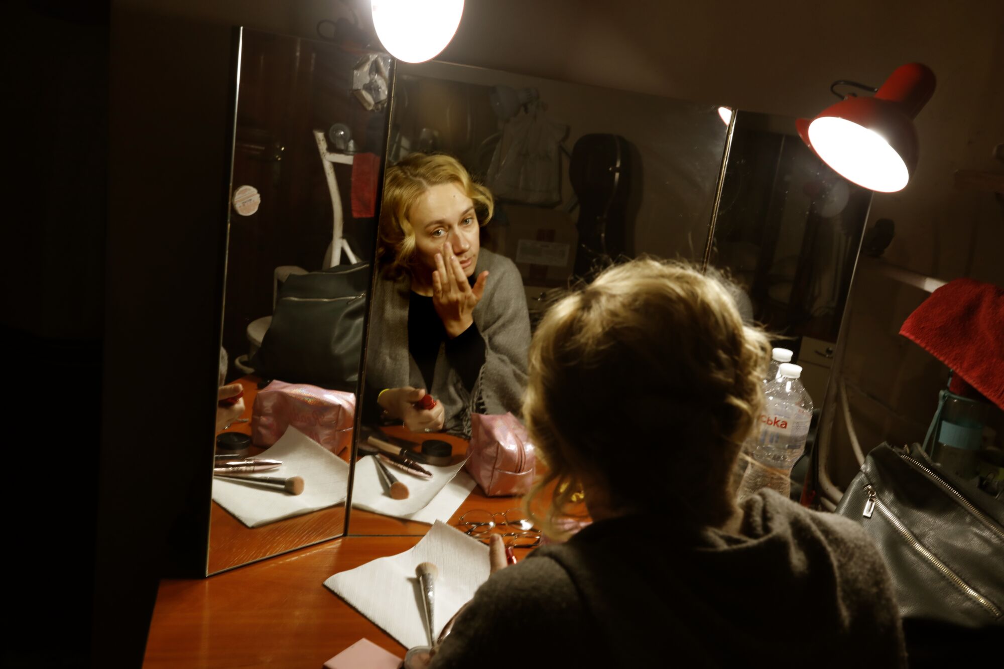 At the National Academy Ivan Franko Drama Theater, actress Vira Zinevych-Mazur prepares to go on stage