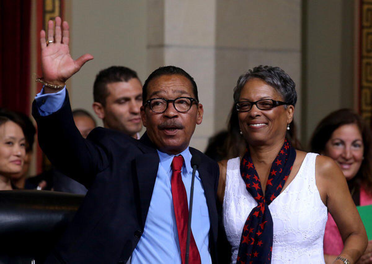 Herb Wesson with wife Fabian, acknowledges applause after being reelected president of the Los Angeles City Council.