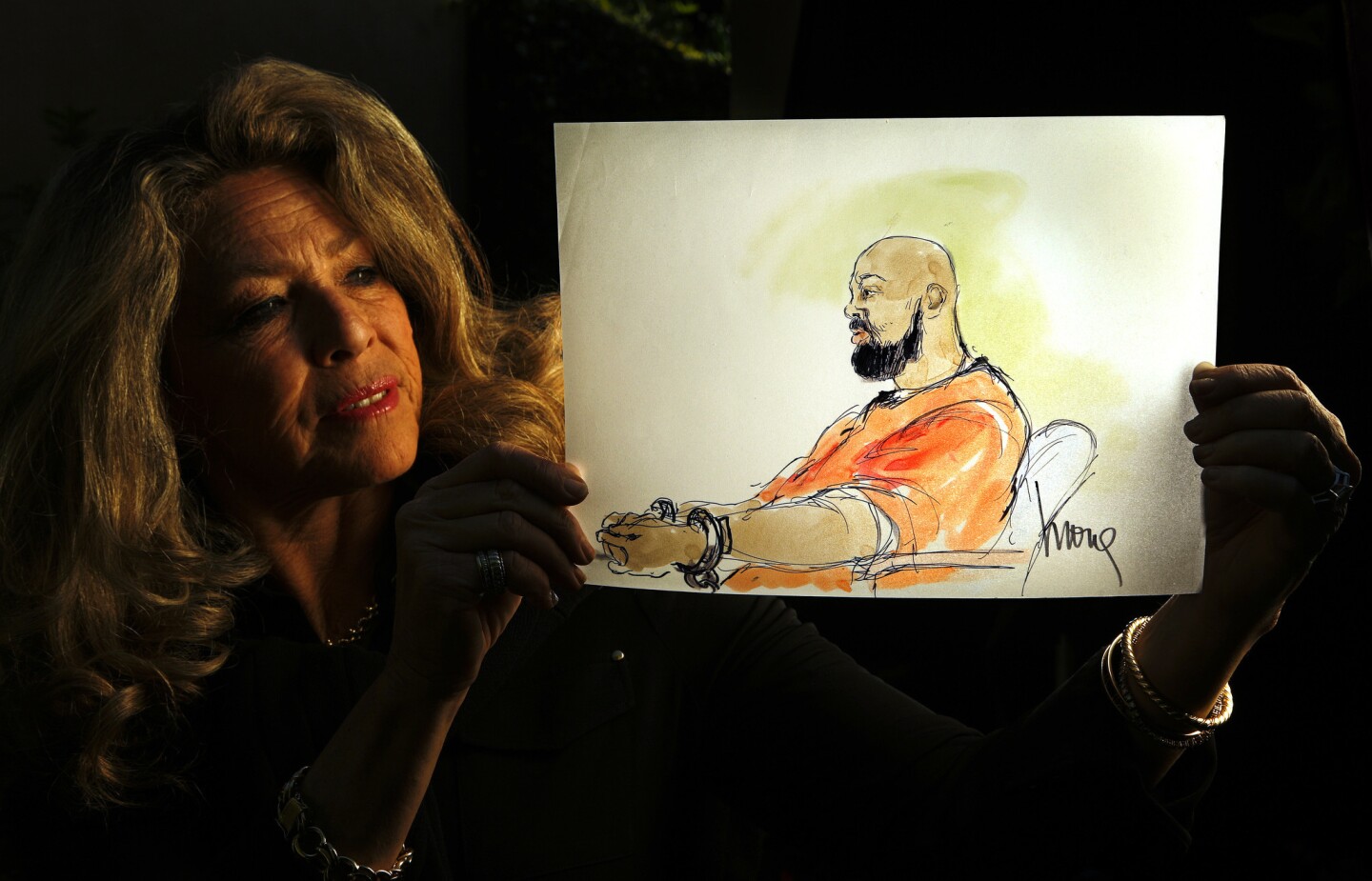 Mona Shafer Edwards displays a sketch she did of former rap mogul Marion "Suge" Knight during a hearing about evidence in his murder case. The fear of the day when she is no longer needed is always present. Sometimes the phone doesn’t ring for weeks. “I always wonder, is this the last job? Is this my last story?” she said. “But then the phone rings.”