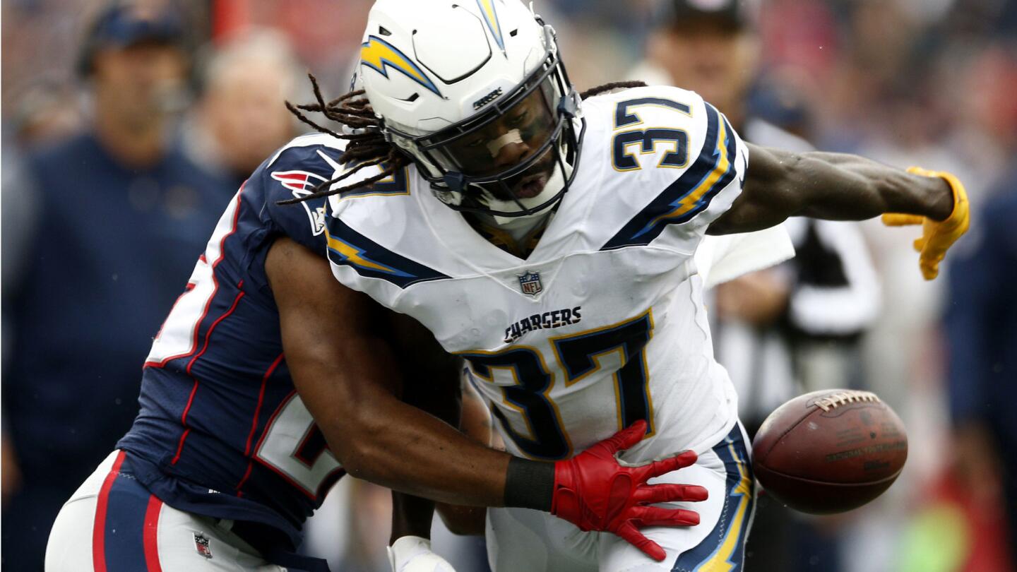 Chargers strong safety Jahleel Addae, right, interferes with a catch attempt by Patriots running back James White during the first half.