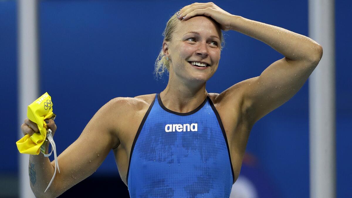 Sweden's Sarah Sjostrom celebrates after winning the gold medal in the women's 100-meter butterfly in world-record time.